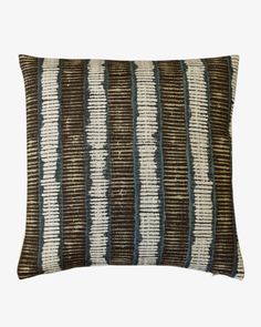 a brown and white striped pillow on a white background with blue stripes in the middle