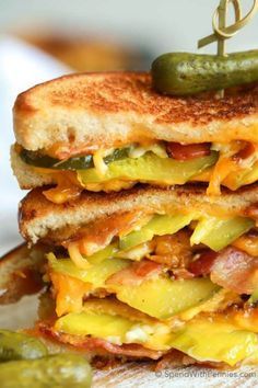 a grilled cheese and bacon sandwich with pickles