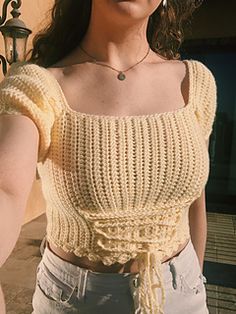 a close up of a person wearing a crop top