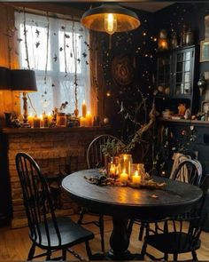 a dining room table with candles on it