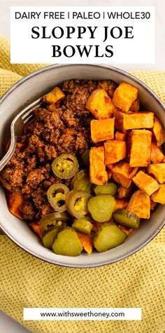 a bowl full of sloppy joe bowls with olives and pickles in the side