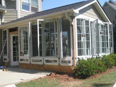 a house with several windows in front of it