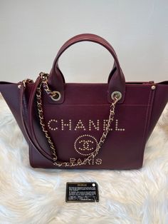 Authentic Chanel, purchased for my wife here at Chanel of Saks, Naples, FL Pre owned in very good condition! This Chanel Tote bag is a must-have for any fashion-forward woman. Crafted from high-quality leather and adorned with the iconic CHANEL Caviar logo, this bag is both stylish and practical. The burgundy exterior color and gold hardware color make this bag a statement piece that will elevate any outfit. With a Medium size and a comfortable leather handle/strap material, this tote bag is perfect for everyday use. It is designed to meet the needs of women who want to keep their hands free while still looking chic. The CHANEL brand is synonymous with quality and luxury, and this bag is no exception. Priority Free Shipping! Only United State Buyers! NO RETURN ! Chanel Girl, Tote Bag Luxury, Chanel Tote Bag, Chanel Brand, Chanel Tote, United State, Chanel Caviar, Naples Fl, Tote Bag Leather