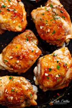 chicken thighs with garlic and seasoning in a skillet