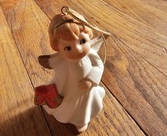 an angel ornament on a wooden table