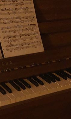 an old piano with sheet music on it