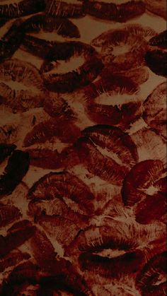 an abstract painting with red and brown colors