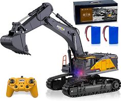 the remote control excavator is next to it's box and its contents