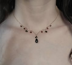 Enchantress. As the crisp breeze of October envelops us, and the nights grow longer, the ecnchantress' heart is drawn to the enigmatic essence of the Dark Feminine. The black onyx drop sparkles magically with every tiny movement. Combined with the tiny delicate raw dark red garnet gemstones and the 14K gold over sterling silver 925 chain and components, this necklace is a dark poem, full of moonshine and bewitching energy of a fairy tale. Perfect piece for a dark etherial / gothic wedding. Avail Silver Garnet Necklace, Dark Feminine Jewelry, Gold Gothic Jewelry, The Dark Feminine, Emo Jewelry, Witchy Necklace, Raw Garnet, Ethereal Jewelry, Feminine Jewelry