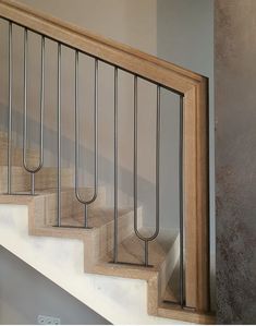 a set of stairs with metal handrails on each side