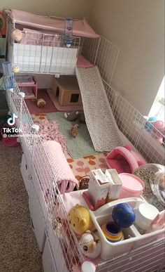 a doll house with pink furniture and accessories in the living room, as seen from above