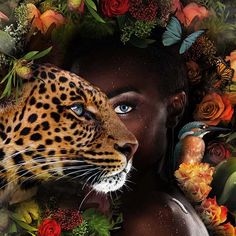 a woman with blue eyes is surrounded by flowers and butterflies as she holds a leopard's head