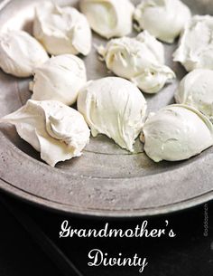 some white food is sitting in a metal bowl on the table and ready to be eaten