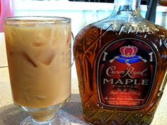 a bottle of maple syrup next to a glass filled with liquid