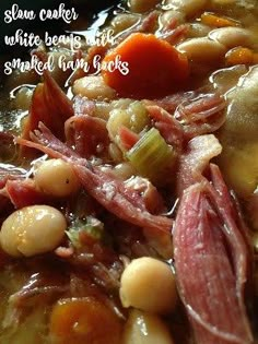 a bowl filled with soup and beans on top of a table