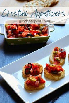 small appetizers are arranged on white plates