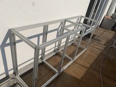 a metal frame sitting on top of a hard wood floor