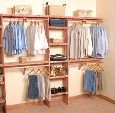 an organized closet with clothes, shoes and other items on shelves in the corner between two walls