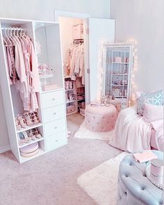 a room filled with lots of white furniture and pink accessories on top of carpeted flooring