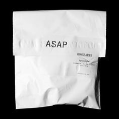 a white bag with the word asap printed on it