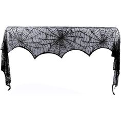 a black table cloth with spider webs on it