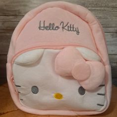 Pastel Pink And Soft Hello Kitty Mini Backpack Zippered Pockets In The Front, Hello Kitty Shaped Pocket With Zipper. Inside- Small Pocket Size: 18cm X 8cm X 23cm Cute Pink Softback Backpack, Cute Hello Kitty Backpack For Daily Use, Pink Kawaii Hello Kitty Backpack, Cute Hello Kitty Standard Backpack, Cute Pink Backpack With Cat Design, Cute Hello Kitty School Backpack, Cute Pink Hello Kitty Backpack, Cute Pink Cat Design Backpack, Kawaii Hello Kitty Bag