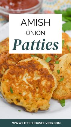 some crab cakes on a plate with ketchup and parsley in the background