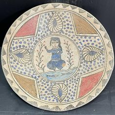 a decorative plate with an image of a woman on it