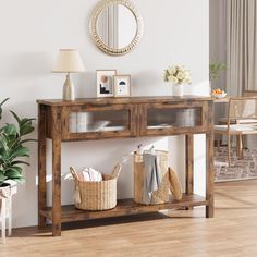 a wooden table with baskets on it in front of a mirror and potted plant