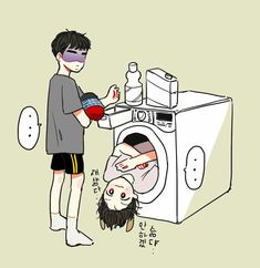 a boy is washing his face in front of the washer