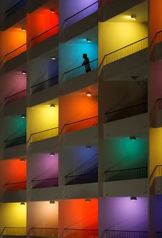 a building with multicolored walls and balconies