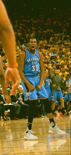 a man standing on top of a basketball court