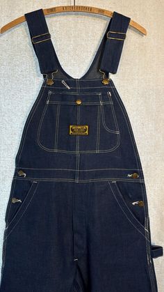 Gorgeous pair of old denim overalls, never worn! They have some light marks (see photos). No bad smells!  Labeled 29" x 36", actual measurements: Waist 30" Seat 46" Thigh 25" Hem 20" Front rise 13" Back rise 14" (from where the bottom of the waist is in the front) Inseam 36" Outseam 47" Please note that I don't accept returns if the item doesn't fit, unless I've made a huge mistake in the measurements or description. Please make sure to read the description and check the measurements carefully a Vintage Denim Blue Overalls With Pockets, Vintage Blue Shortalls, Vintage Bib Front Shortalls With Pockets, Vintage Denim Blue Overalls, Vintage Medium Wash Overalls, Vintage Dark Wash Overalls, Vintage Denim Bib Front Shortalls, Vintage Denim Shortalls With Bib Front, Vintage Denim Blue Bib Front Overalls