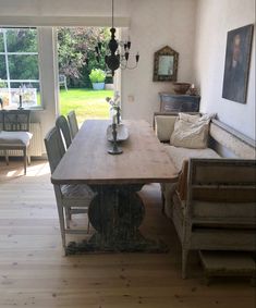 a wooden table sitting in the middle of a living room