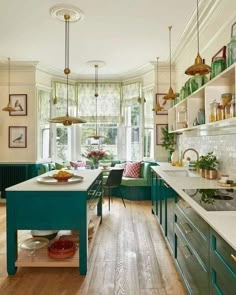 a kitchen filled with lots of counter top space next to a dining room table and chairs