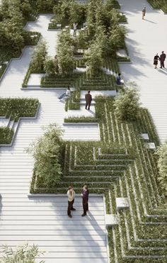 two people are standing in the middle of a maze