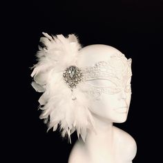 White masquerade Masks woman- Diner en Blanc masks - Wedding masks - Masquerade Ball mask Off white feather mask with gorgeous crystal on silver brooch embellishment, perfect for your all white theme masquerade Ball. If you would like to add Rhinestones to the mask (like shown in the red mask), use the link below to add rhinestones to your purchase. https://www.etsy.com/listing/623069691/add-rhinestones-to-your-masquerade-mask?ref=shop_home_active_7&frs=1 Thank you for supporting small busin White Feather Mask, White Masquerade Mask, White Masquerade, Masquerade Mask Women, Elegant Face Mask, Masquerade Ball Masks, Lace Masquerade Masks, The Mask Costume, Masquerade Ball Mask