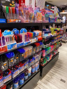 there are many different types of toothbrushes on the shelves in this store,