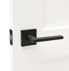 a black door handle on a white door