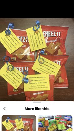 several bags of cheezi crackers on a table with notes pinned to them