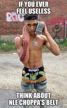 a shirtless man holding a cell phone up to his face with the caption, if you ever feel uses think about nil choppa's belt