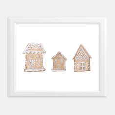 three gingerbread houses in white frame