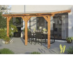 an outdoor dining area with table and chairs under a pergolated roof, surrounded by potted plants