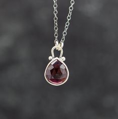 ♦Special Features: This necklace features a garnet set in sterling silver with small silver ball accents. This is a really nice garnet with fantastic clarity and color. Definitely look at the hand photos to see how this stone looks with the light shining in it.♦Length: Choose from drop down. Will come on oxidized cable link chain with 2 inch extension chain. So if you order 16 inches it will be adjustable from 16-18, 18 inches will be adjustable from 18-20 and so on.♦Closure: lobster claw♦ Metal Hand Photos, Hand Photo, Garnet Pendant, The Hand, Necklace Sterling Silver, Fine Silver, Link Chain, Lobster Claw, Silver Pendant