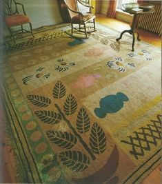 a room with a chair and rug on the floor