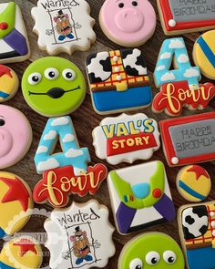 decorated cookies are displayed on a table