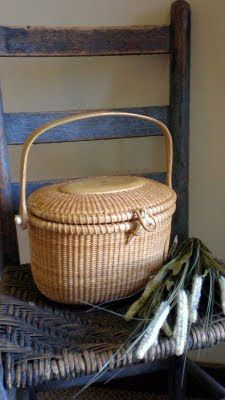 a wicker basket sitting on top of a wooden chair