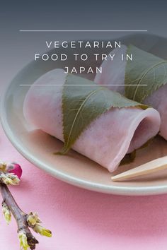 some food on a plate with chopsticks next to it and the words vegetarian food to try in japan