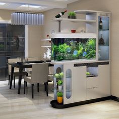 a fish tank sitting on top of a table next to a dining room table and chairs