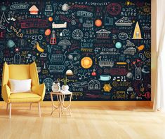 a chair and table in front of a chalkboard wall